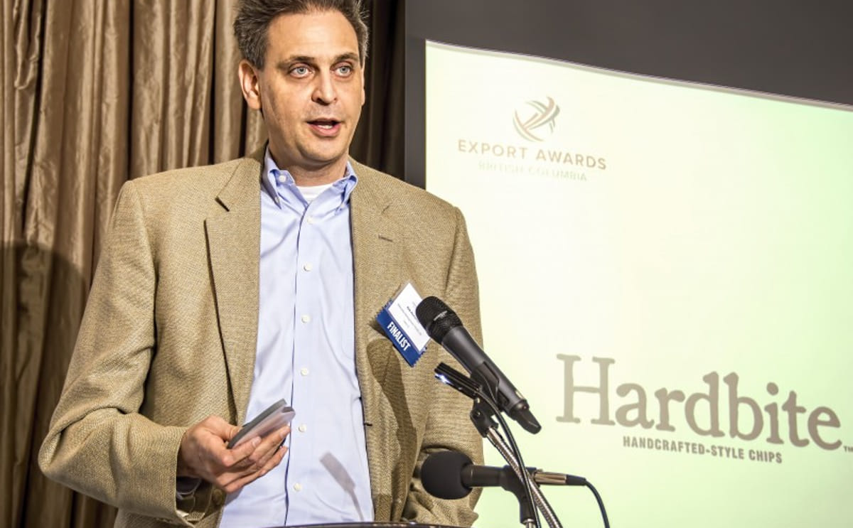 President kirk homenick accepting award