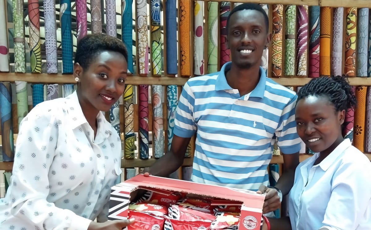 Winnaz employees holding chip box